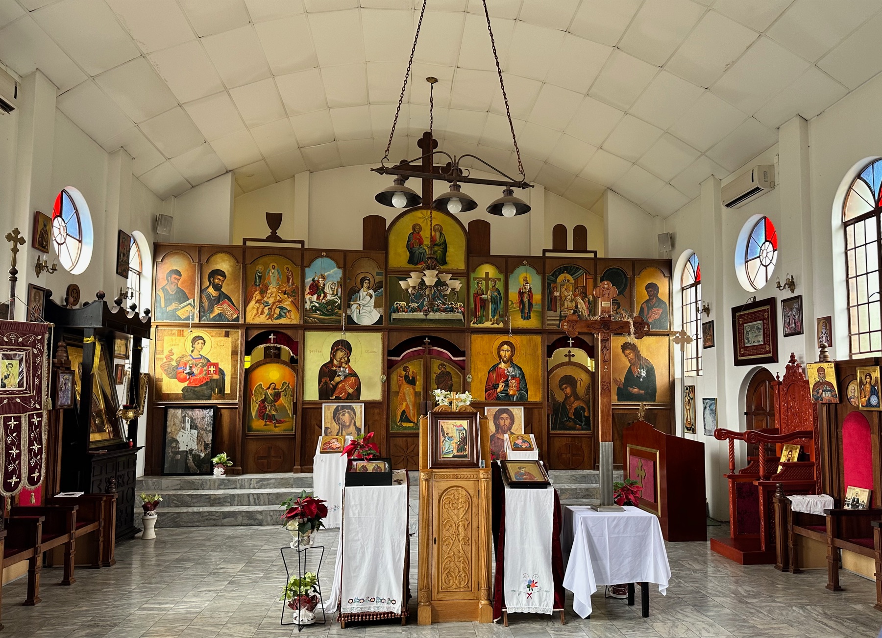 Interior of St Thomas Church with icons and candle stands