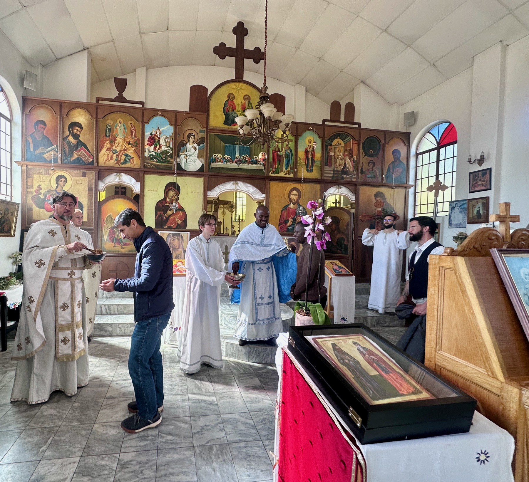 Fr. Markos and Fr. Isajlo distributing antidor after Divine Liturgy