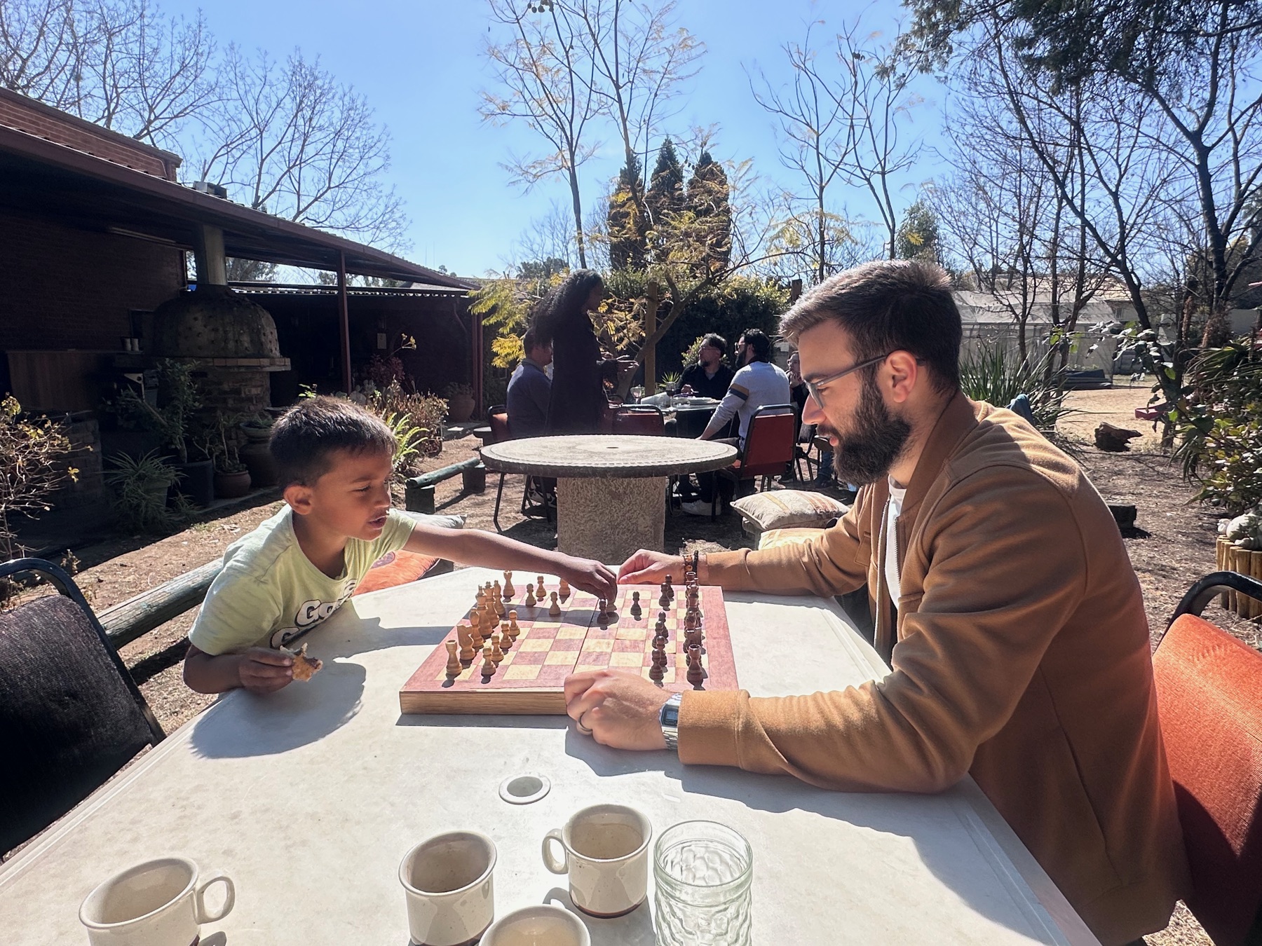 Parishioners of all ages playing chess together after the Sunday service