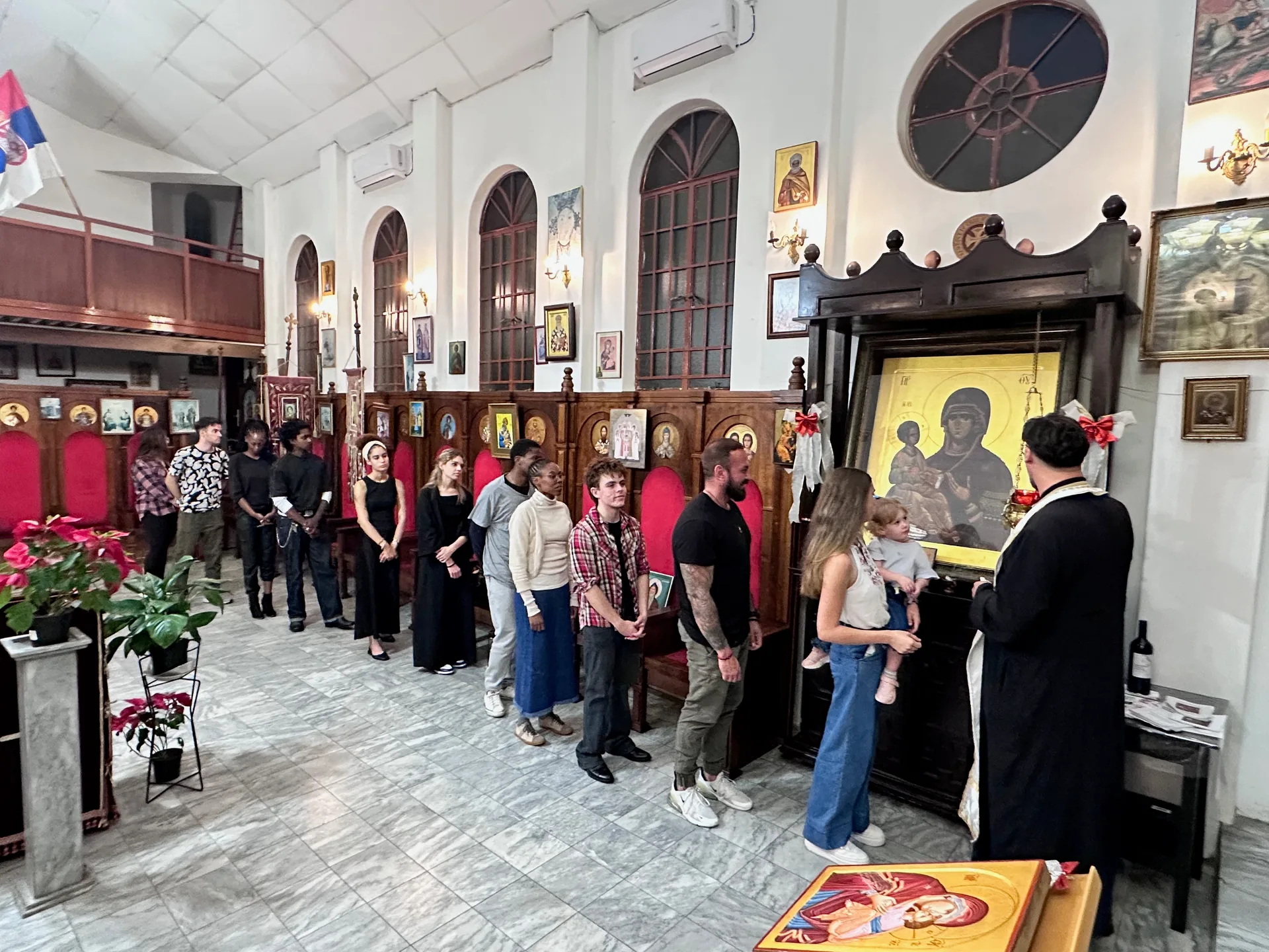 Parishioners lined up for prayer before the Icon of the Theotokos of the Three Hands