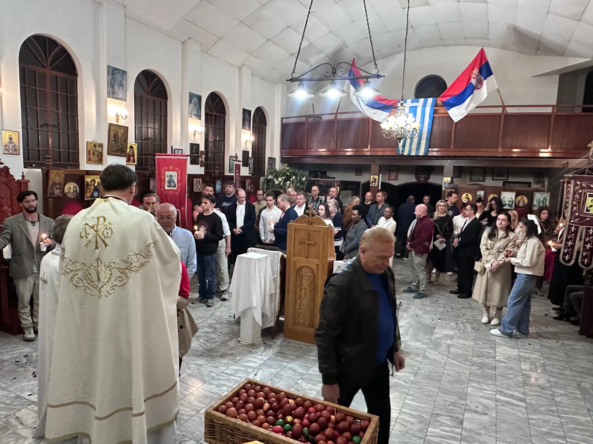 Parishioners receiving blessed Paschal eggs after the Holy Pascha service at St Thomas Serbian Orthodox Church